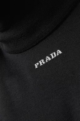 PRADA
Logo Turtleneck Sweater in Virgin Wool